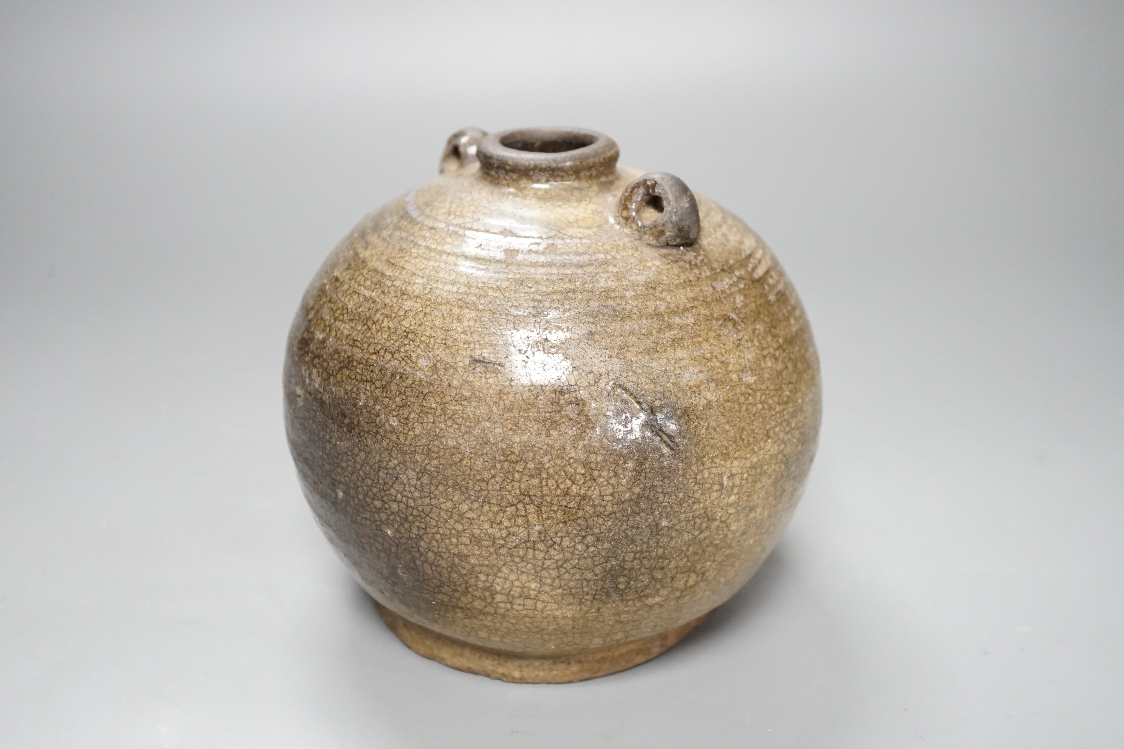 A South East Asian two-handled stoneware jar, possibly Annamese, 15th/16th century, 14cm